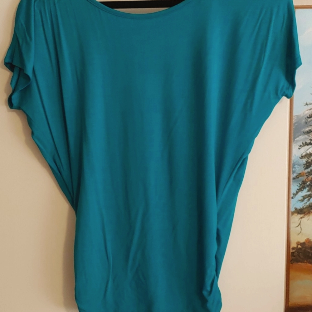 Cute teal top with side ruching and back cutout